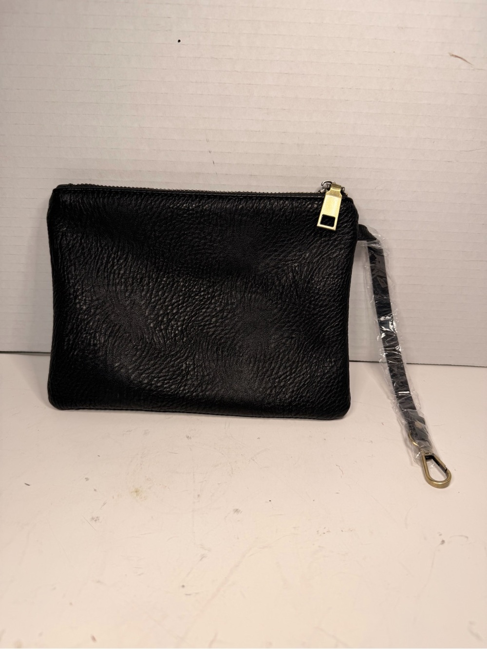 Antik Kraft Black Textured
Leather Wristlet Pouch
Clutch